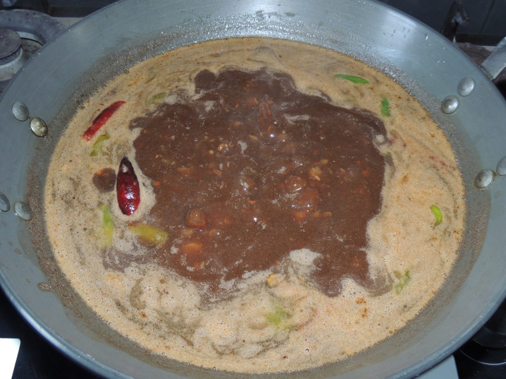 Add salt to the curry. Let cook the curry on medium flame.