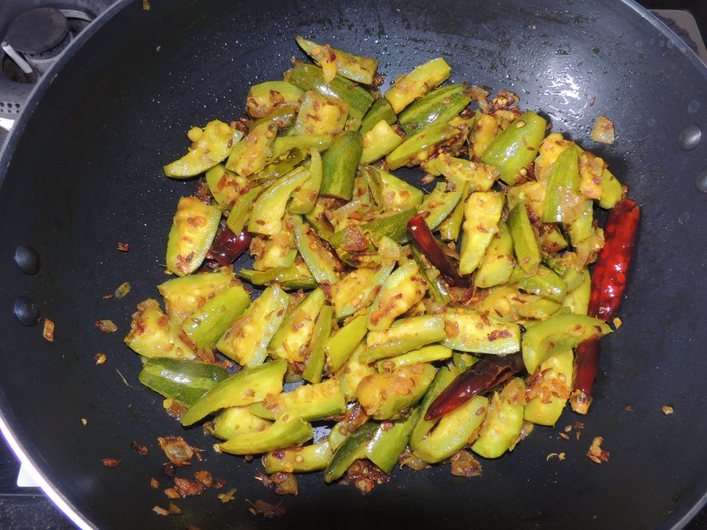 Leave the lid of the kadai / fry pan closed for five minutes. Keep stirring the vegetables periodically.