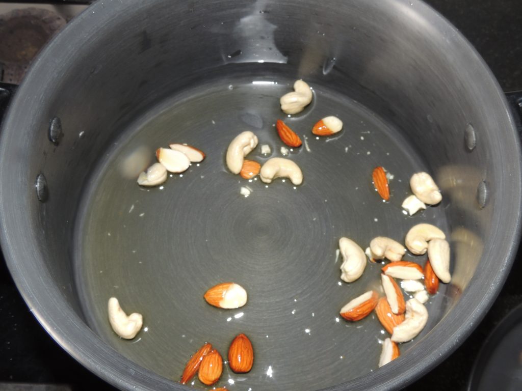 Put Broken cashew and almond in the handi / fry pan.