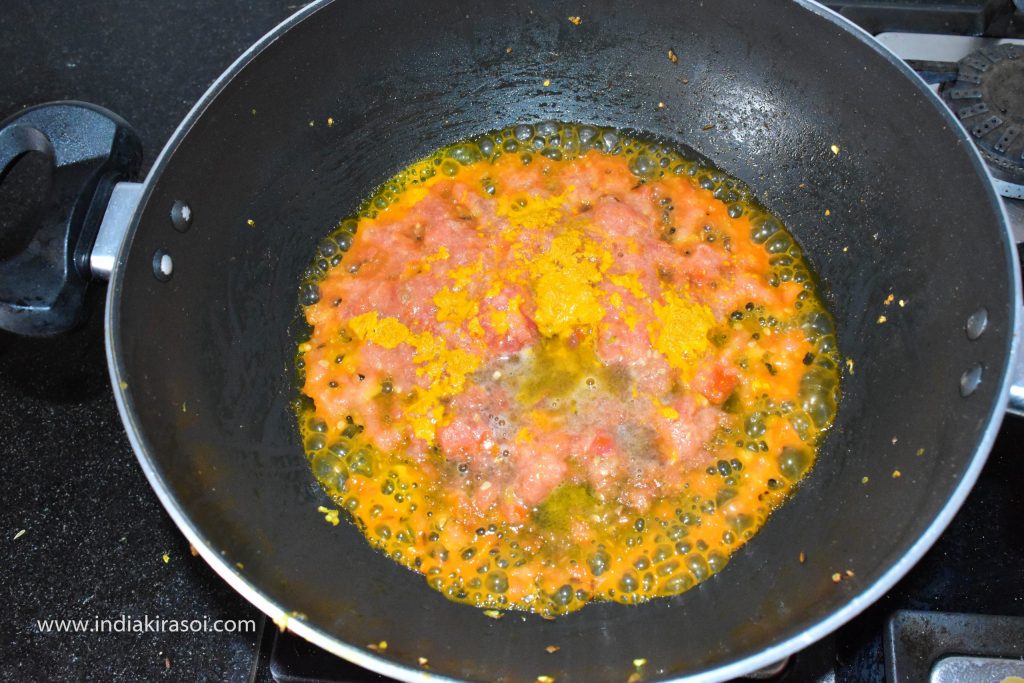 Then add 1/2 teaspoon turmeric powder to the pan.