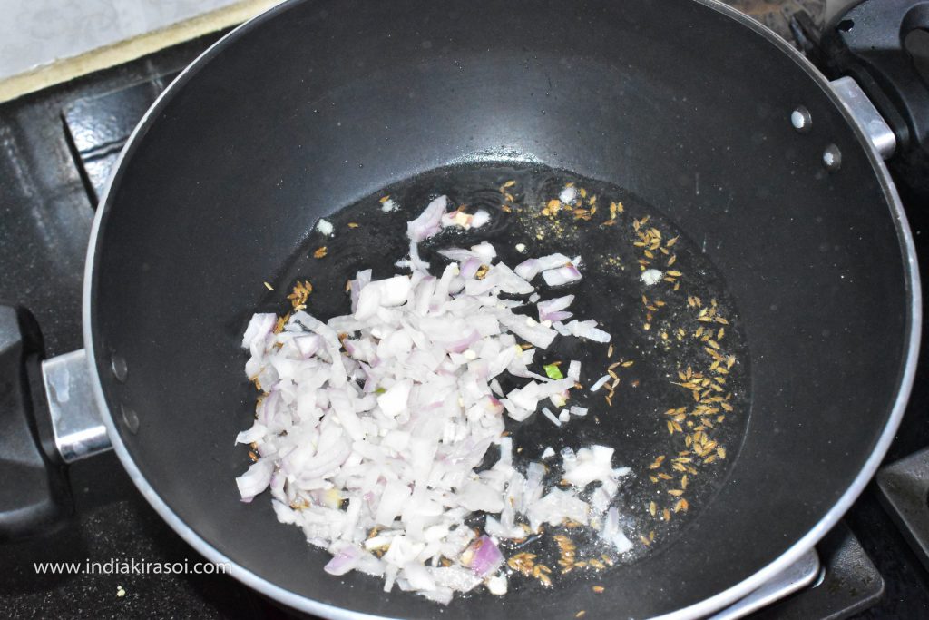 After this add chopped onion, fry the onion for 2 minutes.