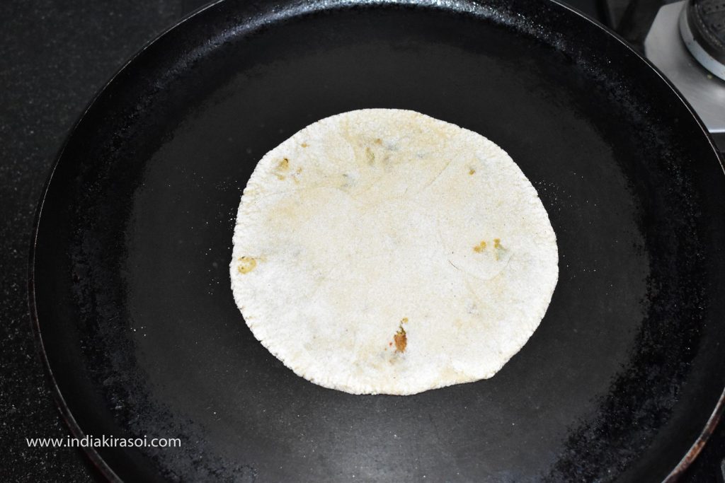 Now put the paratha on the griddle/ tawa.