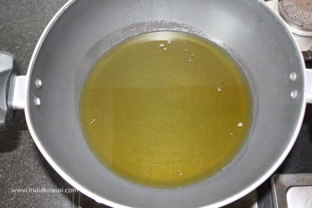 Add about 100 ml oil to the kadhai/ fry pan/ cauldron.