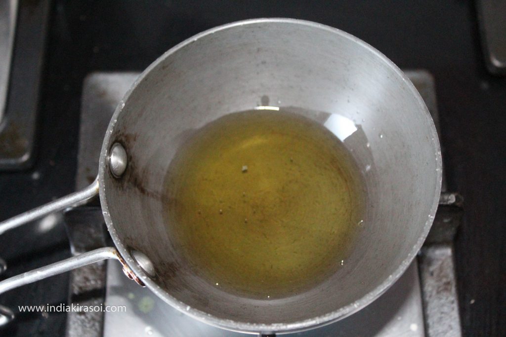 Add 1.5 teaspoons of desi ghee to the tadka pan/ tempering pan.