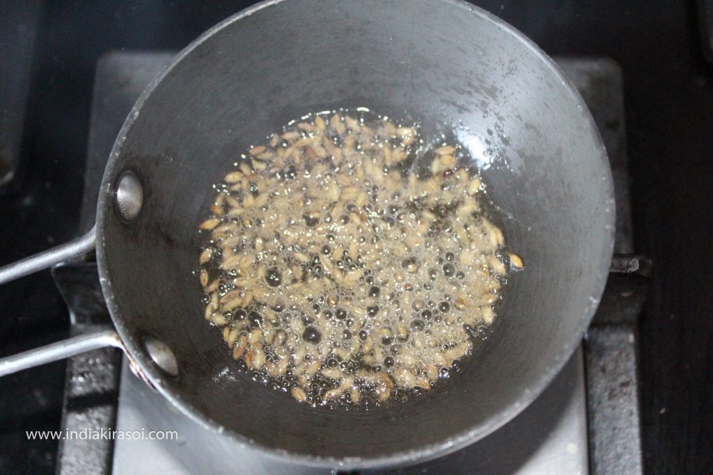 When the desi ghee becomes hot, add one spoon cumin/ jeera seeds to the pan