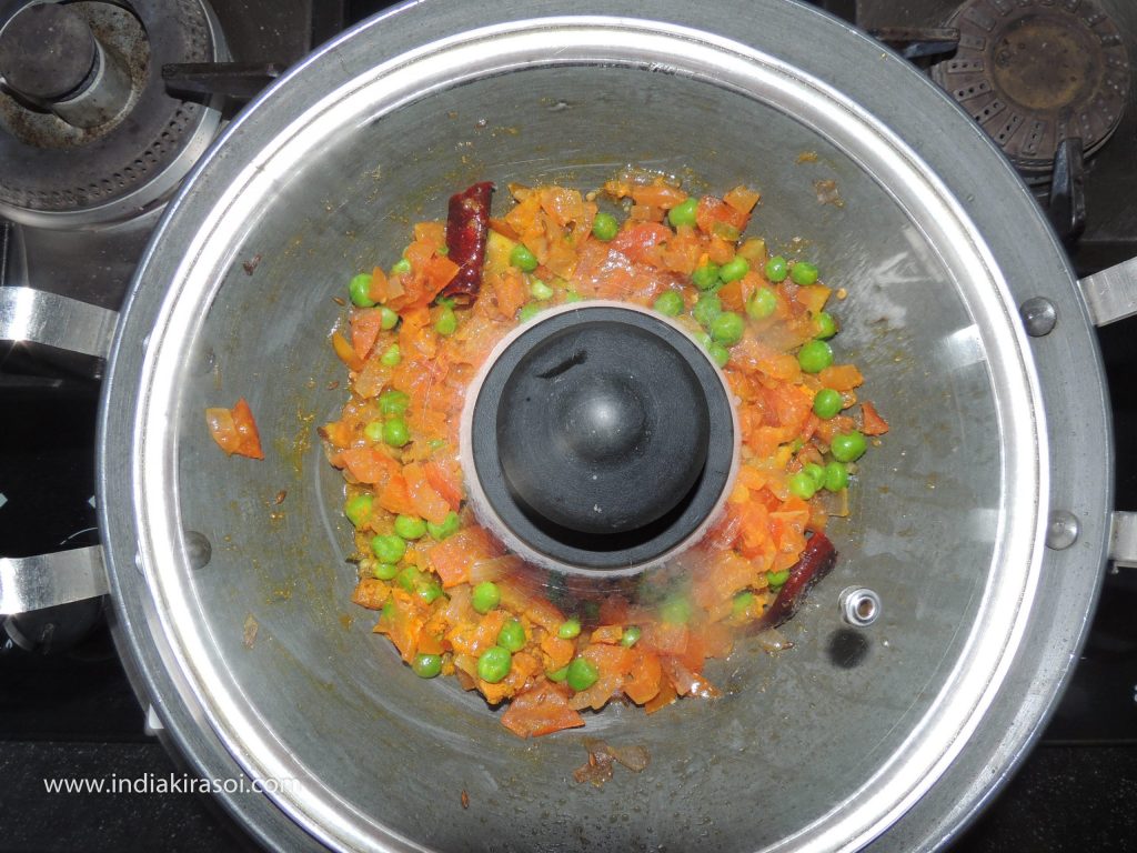 After this, cover the lid on the kadhai/ fry pan.