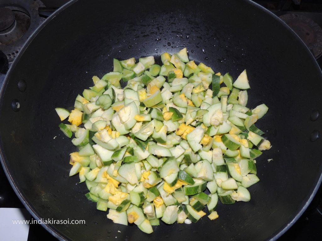 Put chopped pointed gourd/ parwal in the kadhai/ frying pan, fry the parwal.