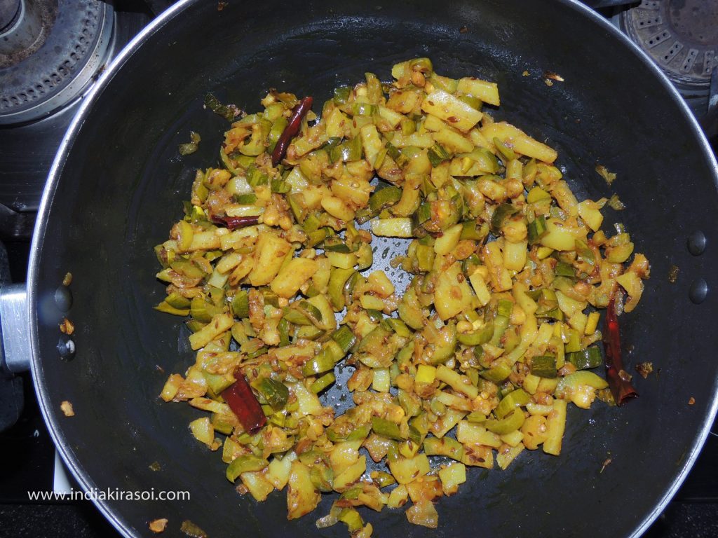 Mix all the spices in the pointed gourd/ parwal well and fry for 2 minutes.
