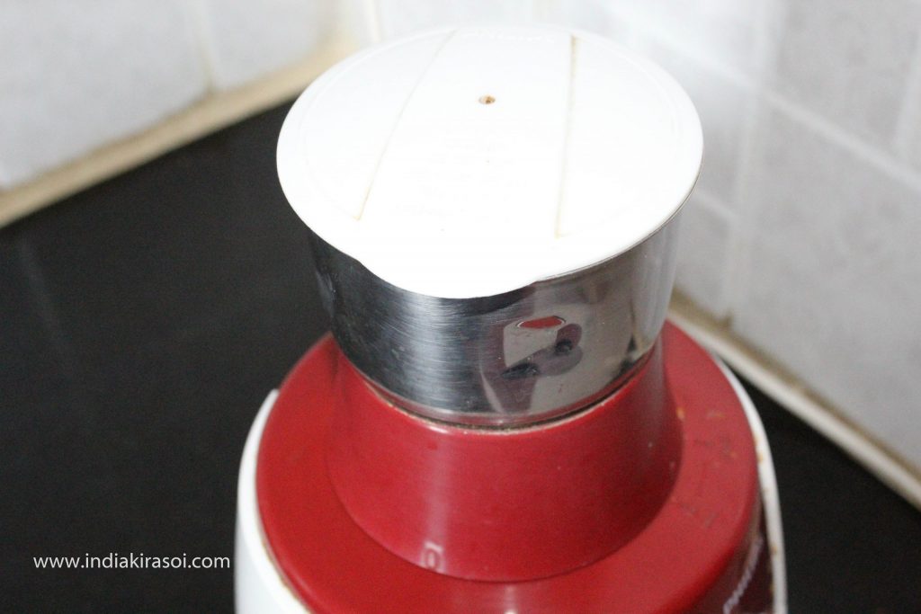 Grind cashew in the mixer grinder.