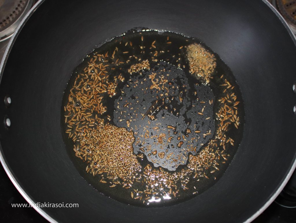 Add a pinch of asafoetida in kadhai/ fry pan.