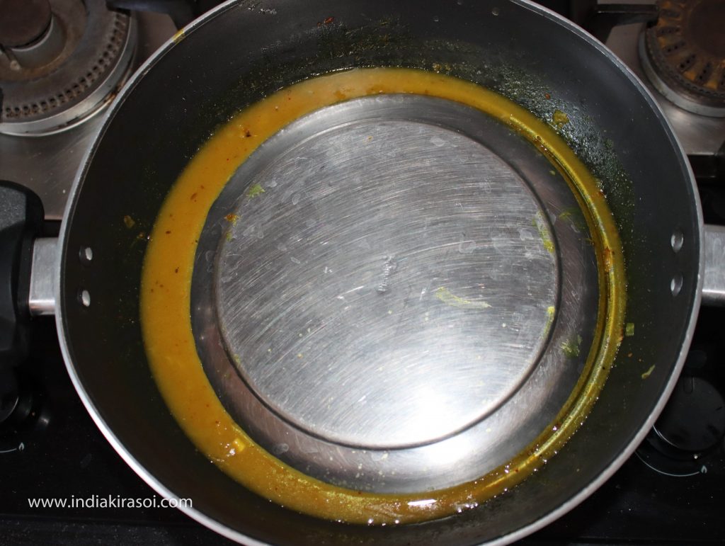 Cover the kadhai/ fry pan again with a plate.