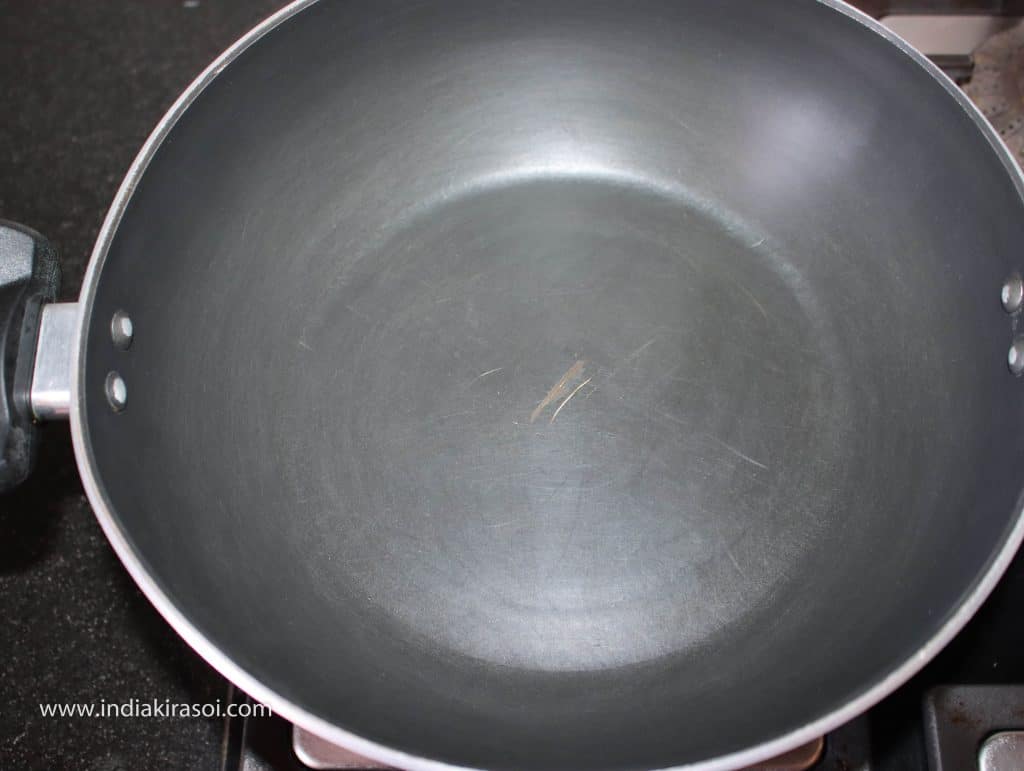 After 10 minutes, put the kadhai/ fry pan on the gas.