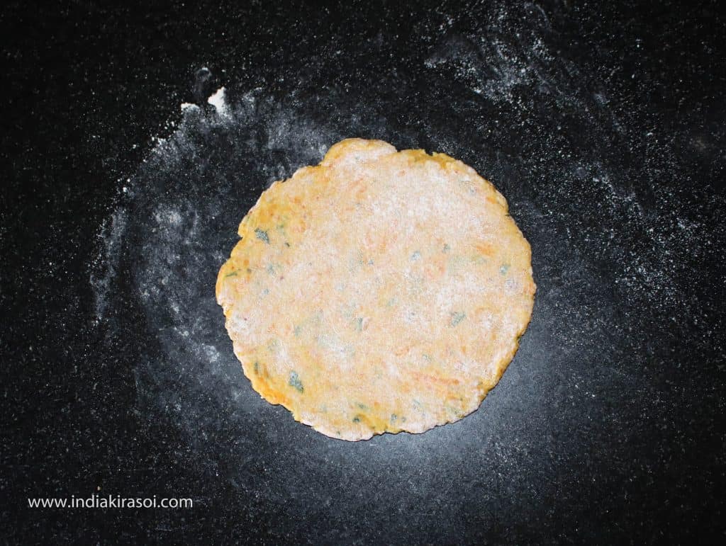 Apply the flour dust enough to make it easier to roll, but keep in mind that do not apply too much flour dust on the dough otherwise, it will be burnt and will leave a black residue on poori.