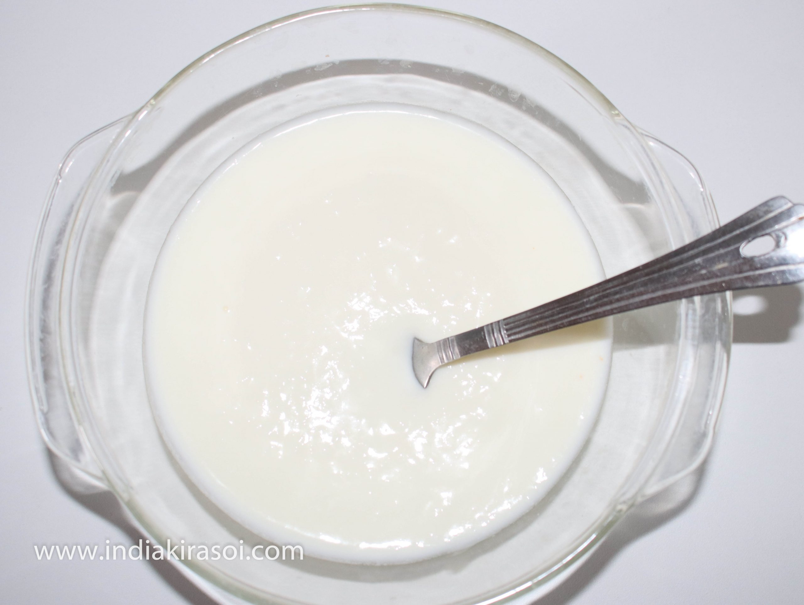 Take about 150 grams of curd/ yogurt in a bowl.