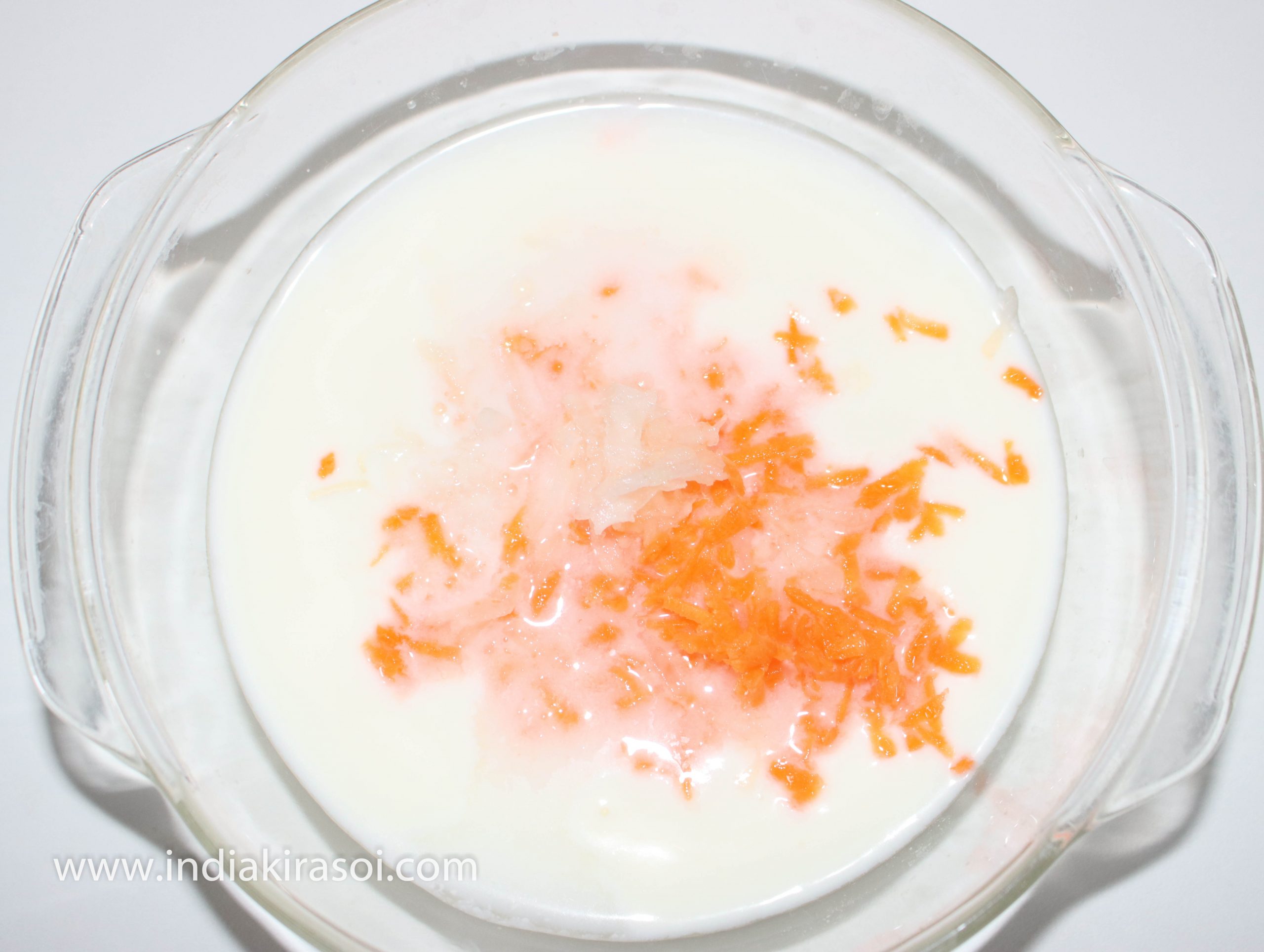 Beat the curd with spoon or beater. Add carrot and radish to the whipped curd/ yogurt.